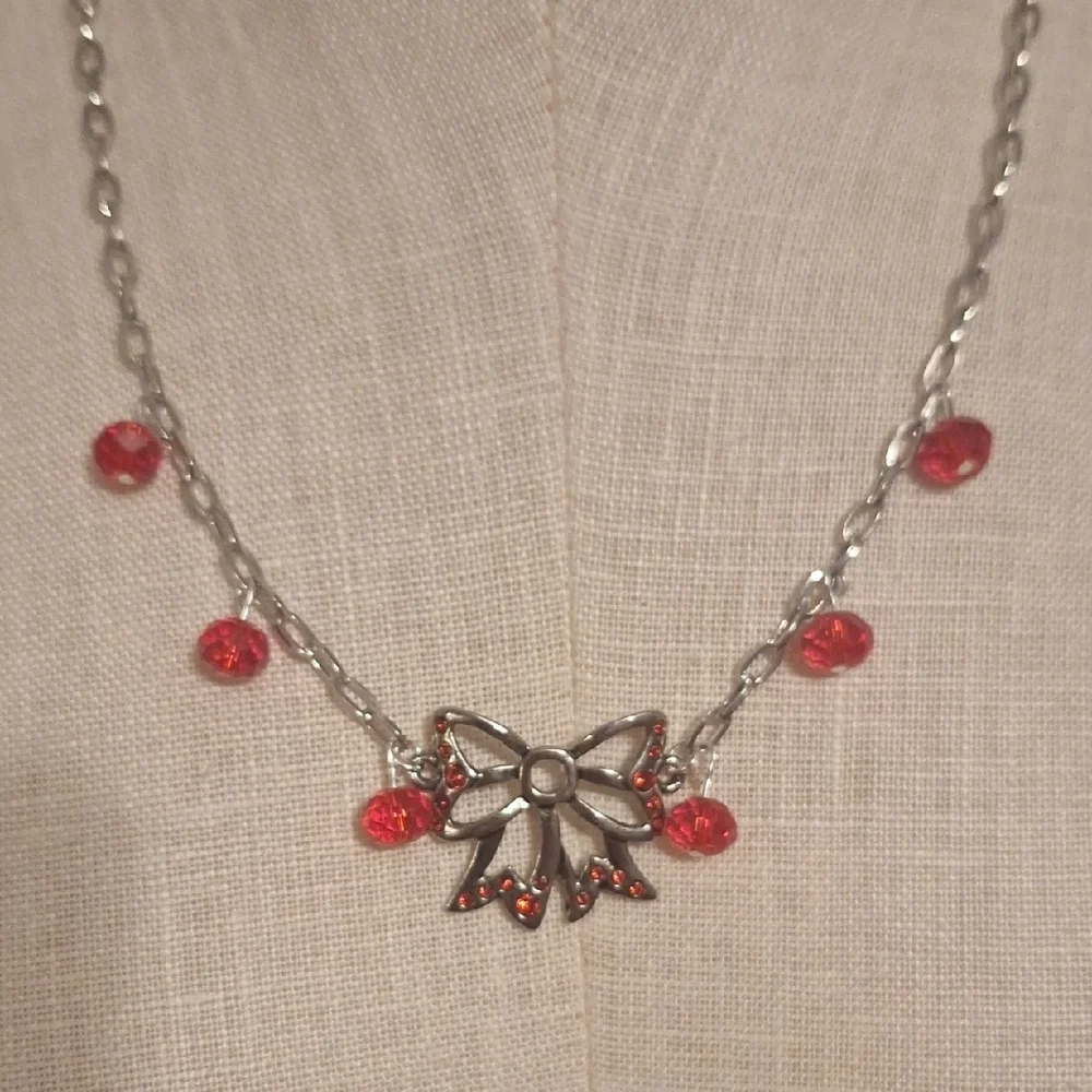 Elegant Silver and Red Bow Necklace